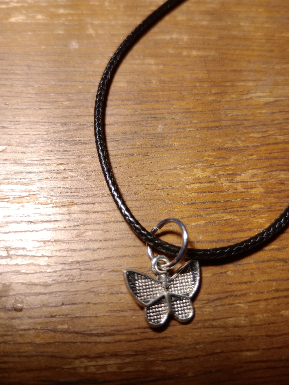 Silver Butterfly Pendant on Black Cord Necklace